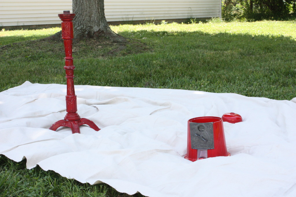 red vintage gumball machine taken apart before priming