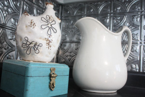 Ceramic hen, milk pitcher and old aqua box