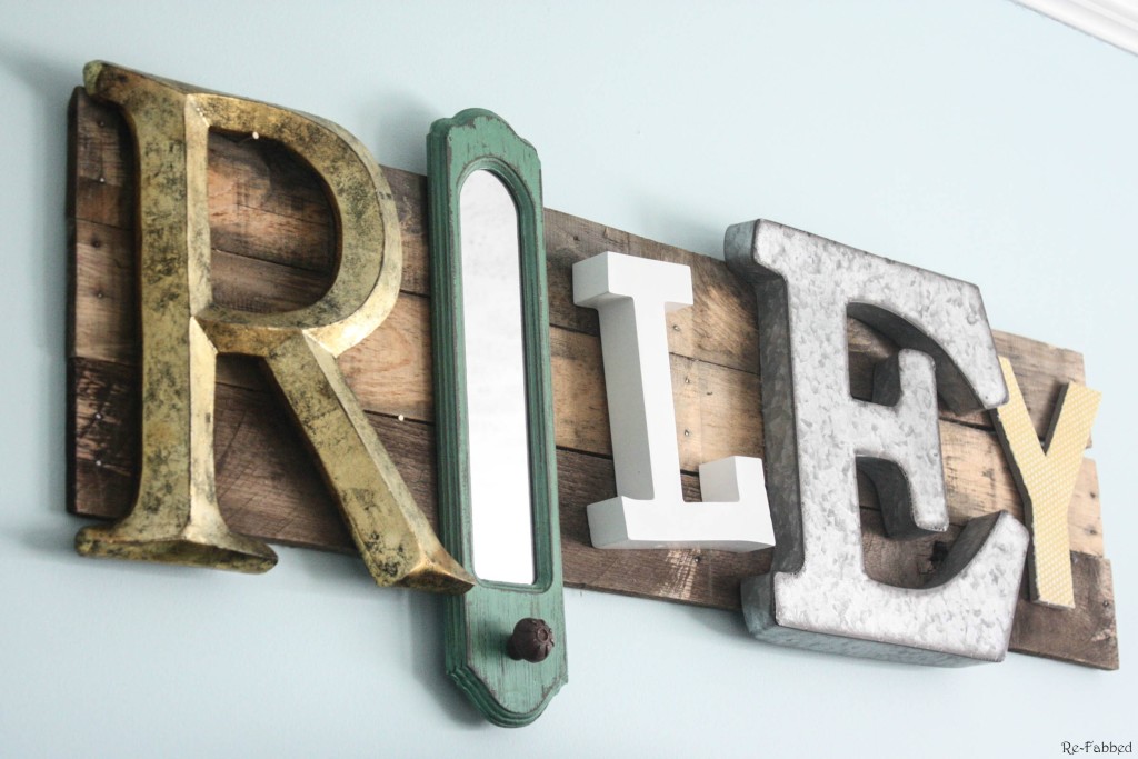 Pallet Name Sign made from random pieces of decor and letters