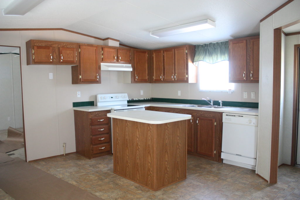 This mobile home kitchen needed major updating, and boy did it get it! Check out the post for how it was transformed {and how the backsplash was only $40}