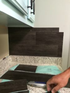 This $40 Vinyl Peel N Stick Flooring Backsplash is thrifty and gorgeous!