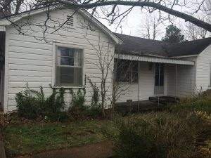 fixer upper home before picture exterior