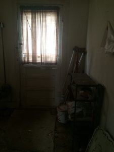 fixer upper house before picture-laundry room