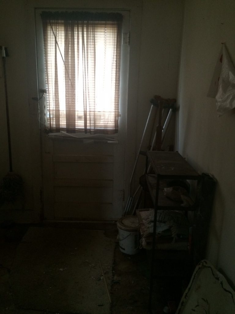 fixer upper house before picture-laundry room