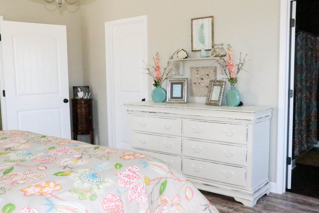 Amazing transformation of a dark and dreary master bedroom into an aqua & coral master bedroom retreat!