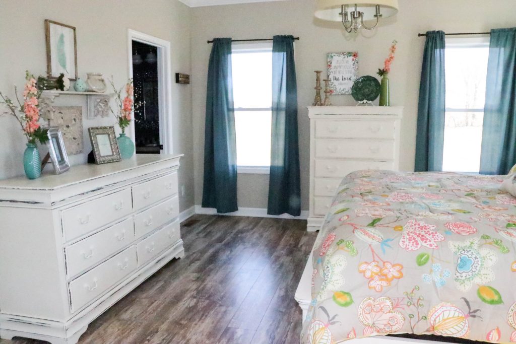 Amazing transformation of a dark and dreary master bedroom into an aqua & coral master bedroom retreat!