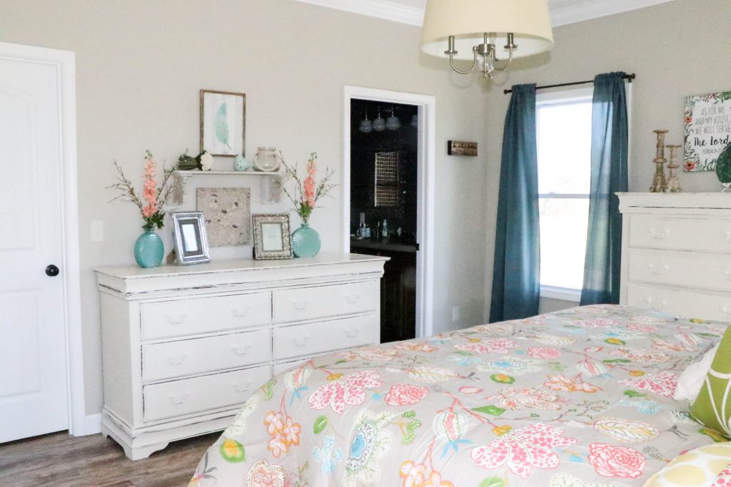 Amazing transformation of a dark and dreary master bedroom into an aqua & coral master bedroom retreat!