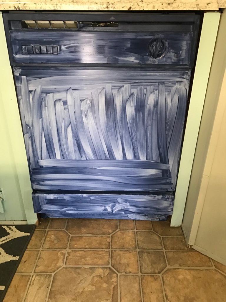 This dingy dishwasher was completely transformed with PAINT! You heard right...a painted dishwasher!  You have got to see this!