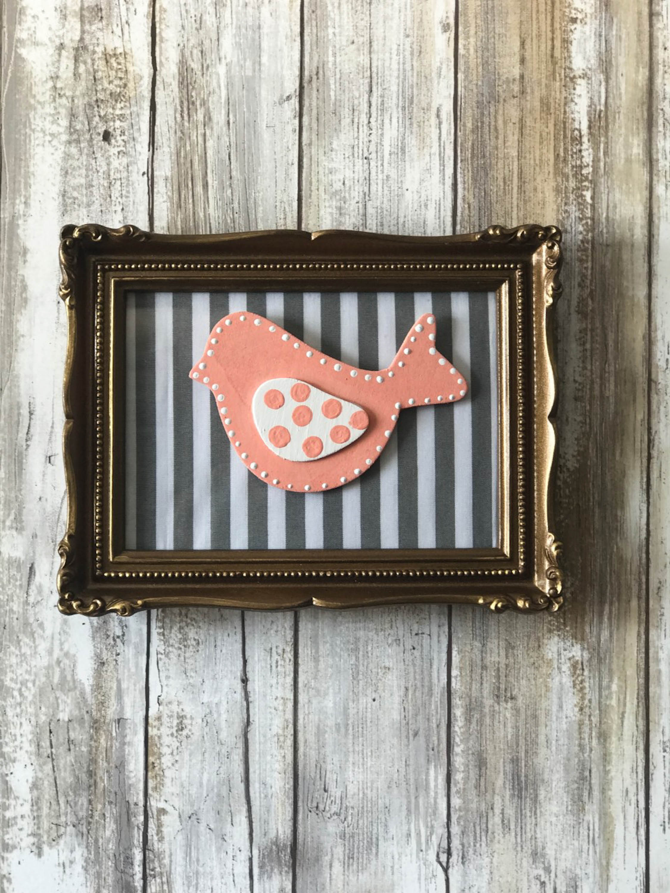 Thrift Store frame with fabric with bird attachment that can be changed with the seasons!