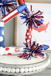 Super cute fireworks using old spindles!