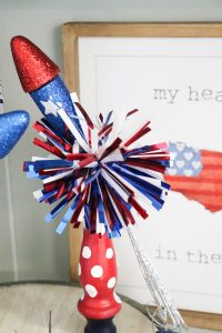 Super cute fireworks using old spindles!
