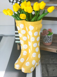 yellow rubber boot flower planter from big lots painting on white polka dots
