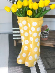 yellow rubber boot flower planter from big lots painting on white polka dots