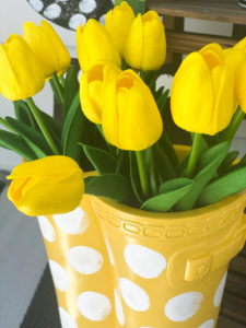 yellow rubber boot flower planter from big lots painting on white polka dots