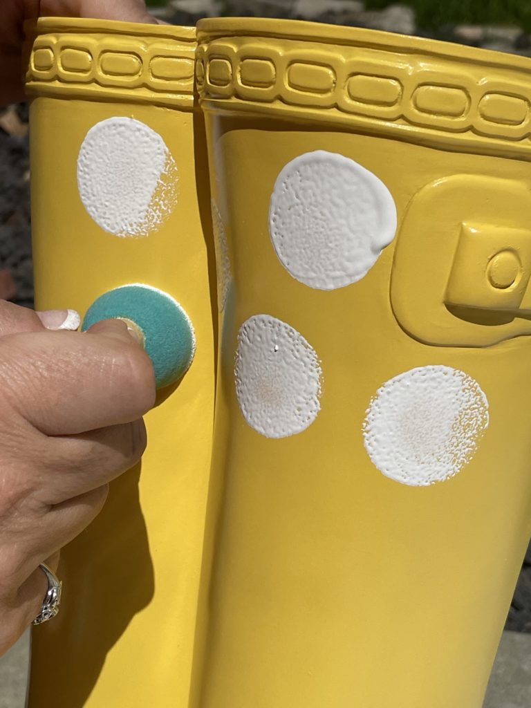 yellow rubber boot flower planter from big lots painting on white polka dots