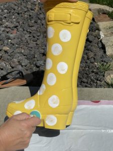 yellow rubber boot flower planter from big lots painting on white polka dots