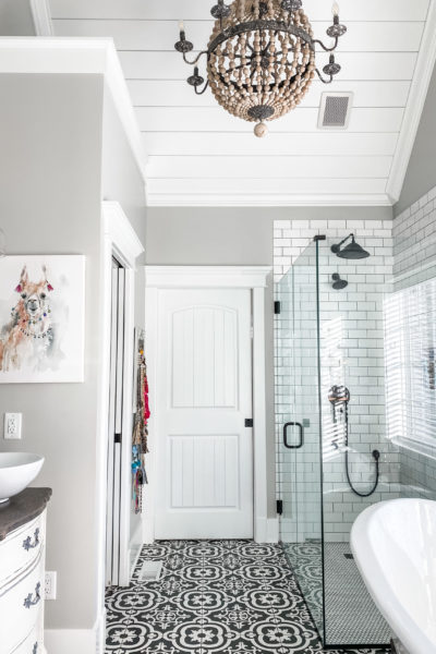 master bathroom view with beaded light fixture