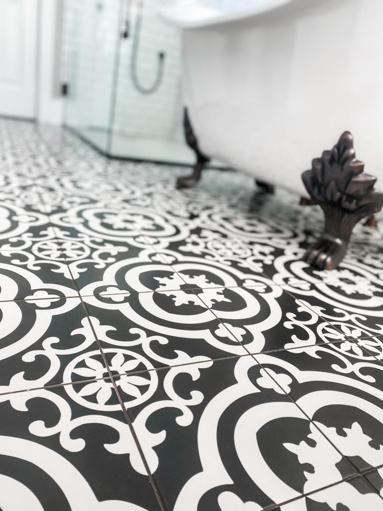 black and white flooring and clawfoot tub