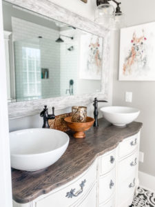 view of master bathroom vanity and llama picture