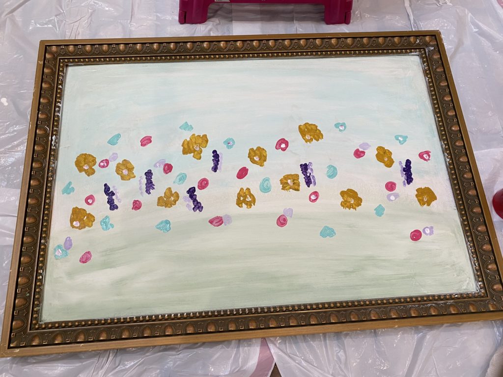 began adding "flowers" to the painting. adding in pink, aqua, and purple