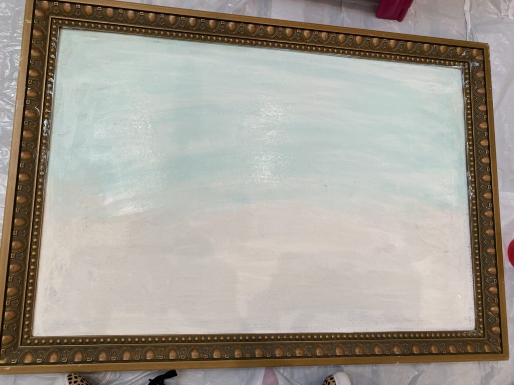 goodwill painting in the process of being painted for wildflowers. painted the backdrop white and added blue