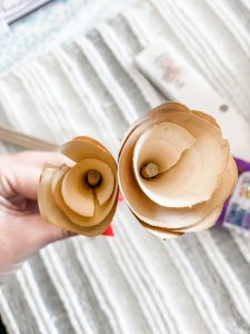close up of dowel rod through rose shaving