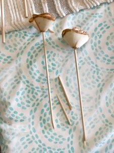 stick dowel rod through rose shaving and break off the end to create different lengths