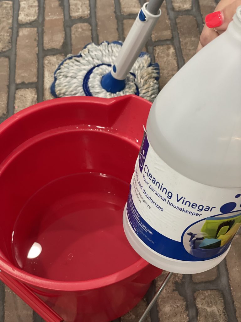 how to clean brick flooring - cleaning vinegar, bucket, hot water, mop, scrubber brush