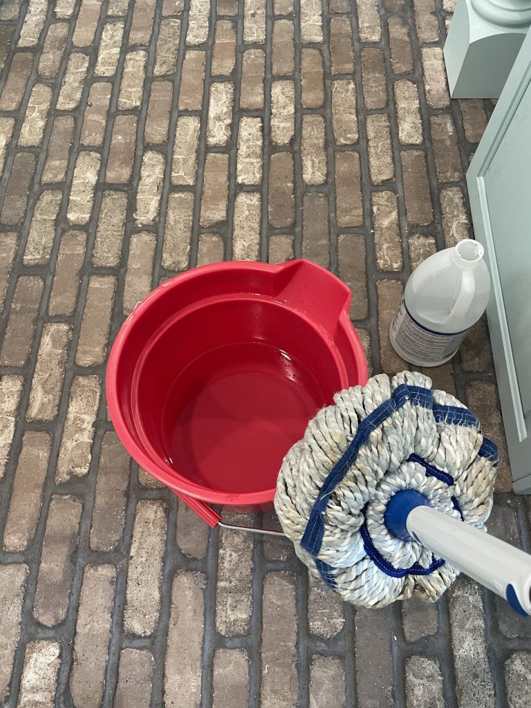 how to clean brick flooring - cleaning vinegar, bucket, hot water, mop, scrubber brush