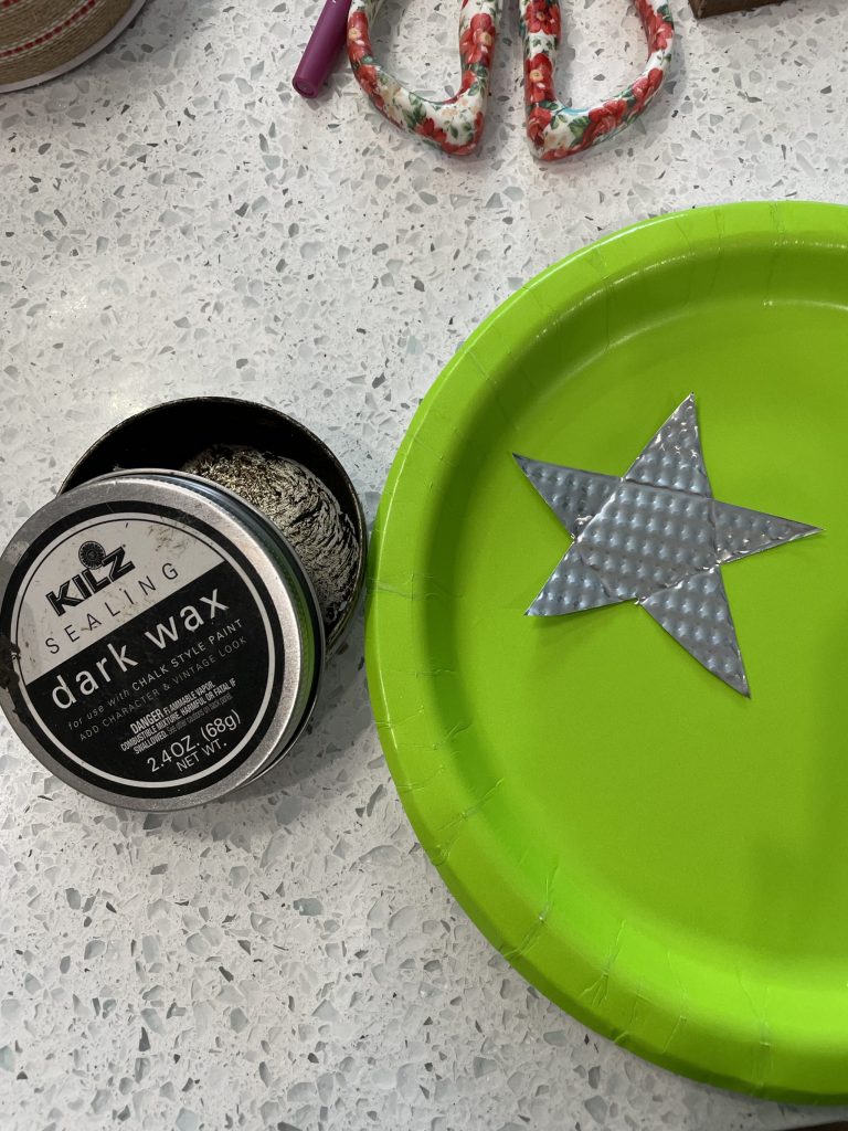 use dollar tree cookie sheet to make rustic star and stain