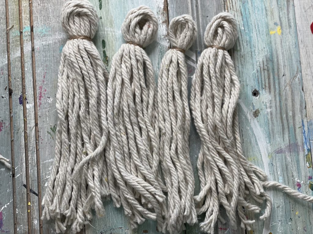 wrap twine around top of mop pieces