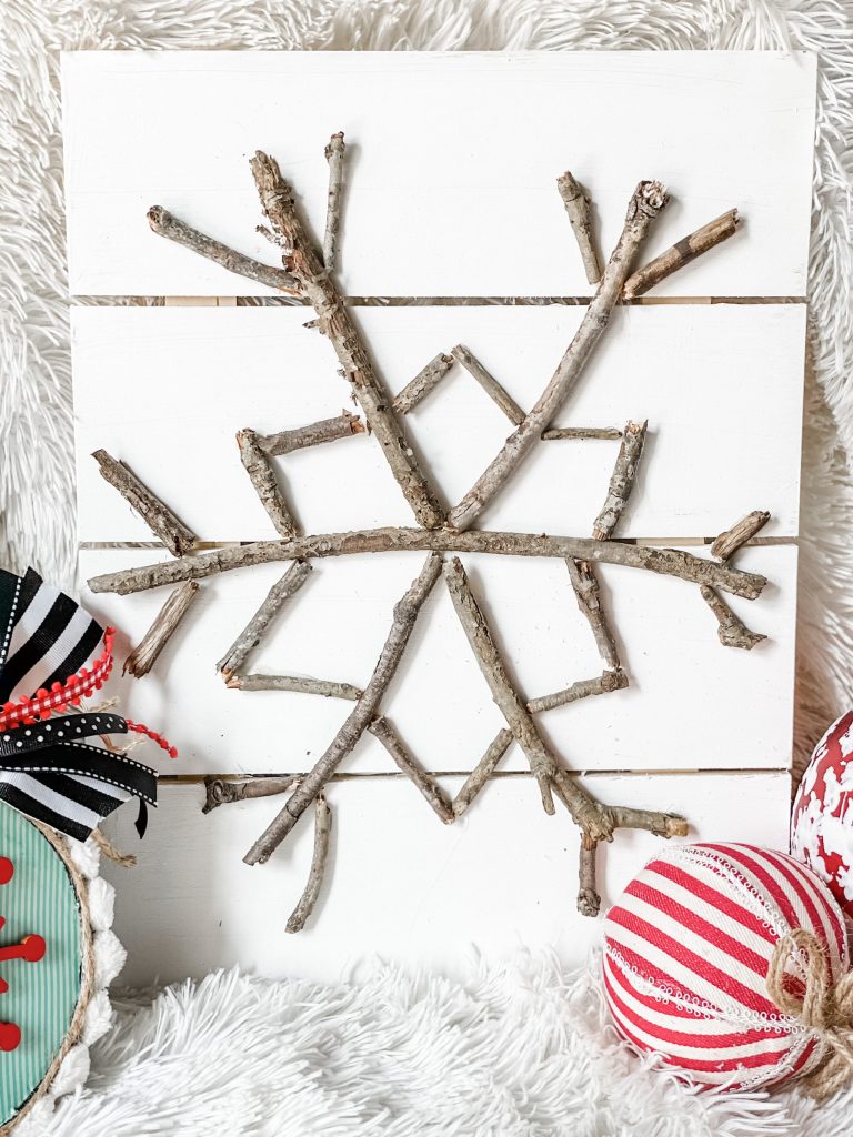 diy stick snowflake sign