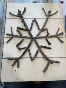 diy snowflake sign made from sticks - pottery barn copy cat