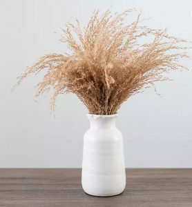 pampas grass with milk glass vase