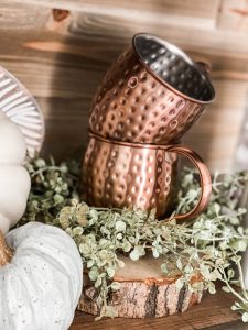 copper cups on fall coffee bar