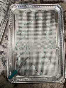 trace out your leaf design onto both cookie sheets