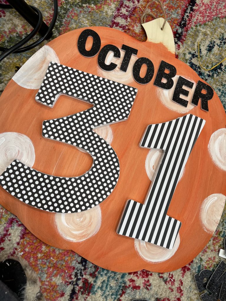 hot glue letters onto the pumpkin, and stick on stickers