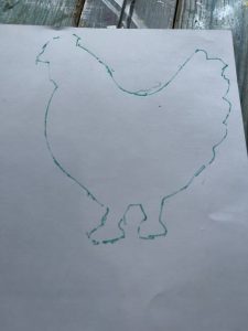 trace the rooster onto a piece of scrapbook paper