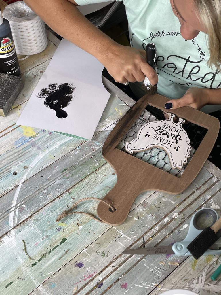 dry brush your sign with black paint
