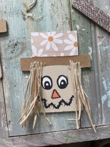 hot glue your raffia underneath the brim