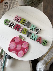colorful merry christmas letters with decorative embellishments. Add painted apple onto door hanger