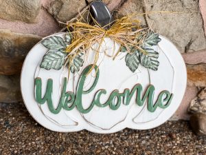 finished look of the diy pumpkin door hanger from big lots