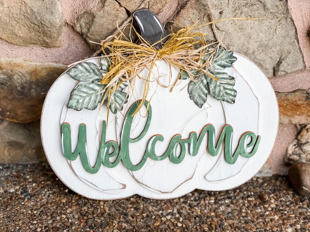 finished look of the diy pumpkin door hanger from big lots