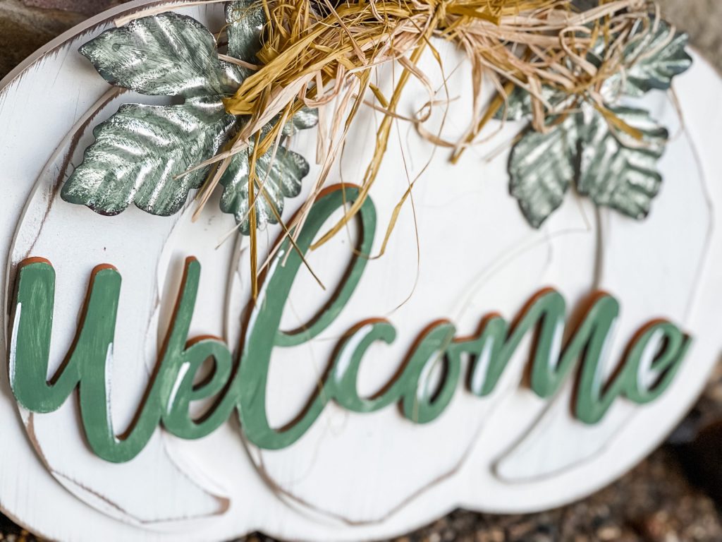 finished look of the diy pumpkin door hanger from big lots