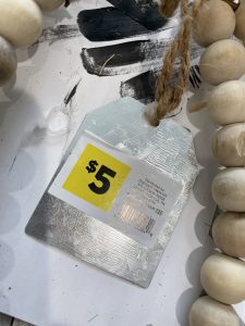 picture of the dollar store tag on pumpkin sign