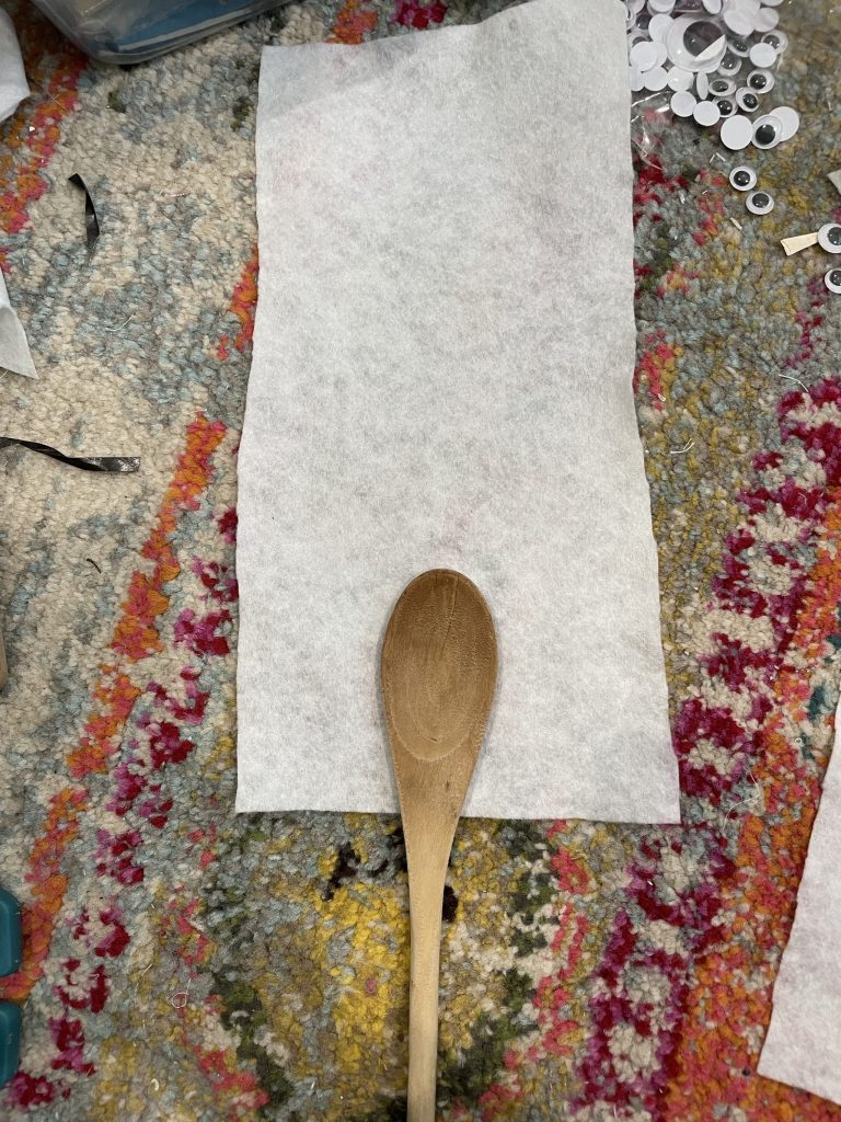 make sure the base of the spoon is at the very bottom of the felt