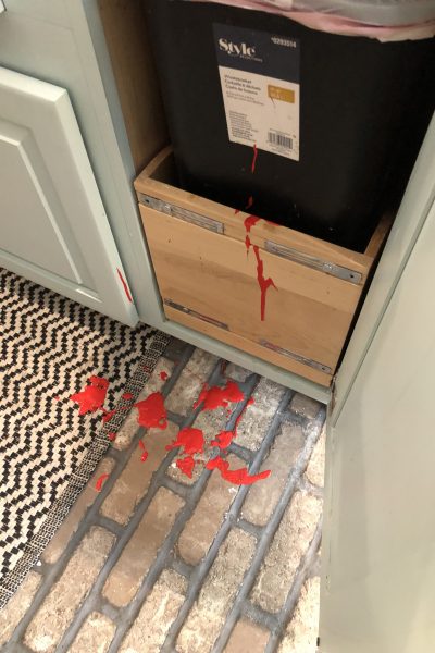 red paint on old mill brick flooring