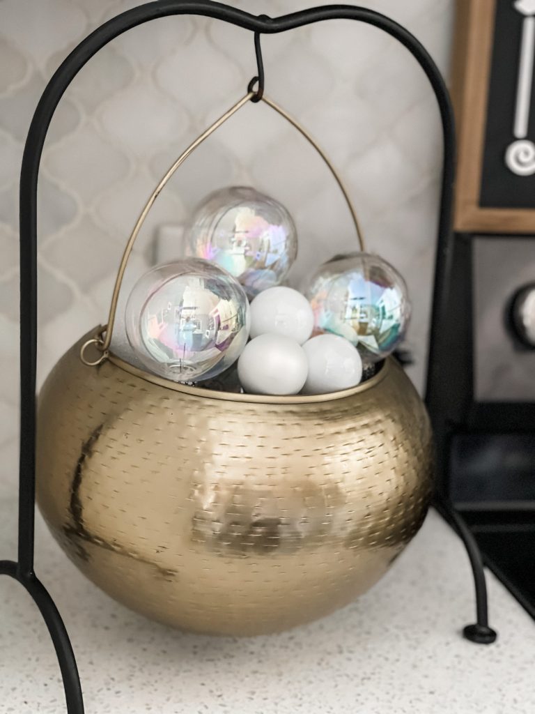 golden cauldron with clear ornaments as bubbles