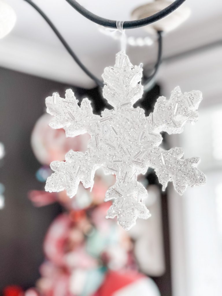 snowflakes hanging from chandelier