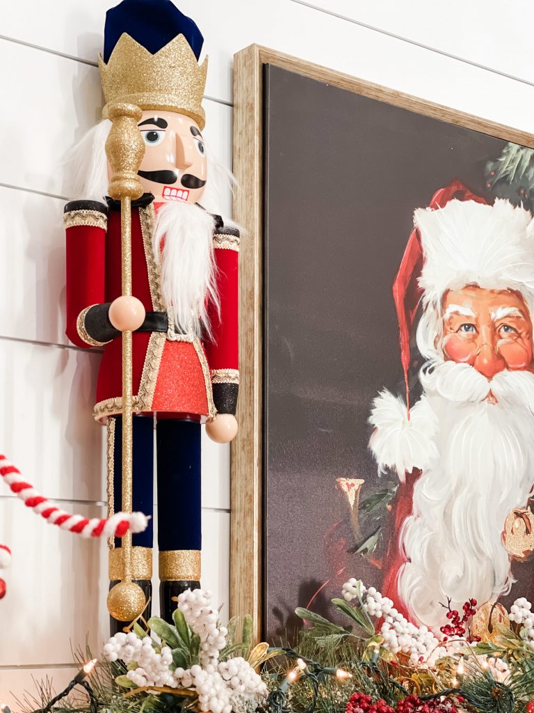 nutcracker and santa picture on mantel
